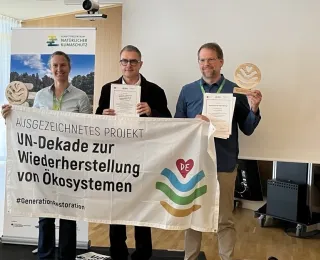 BfN-Vizepräsident Thomas Graner mit Jannes Fröhlich vom WWF und Maike Paul von der Leibniz Universität Hannover
